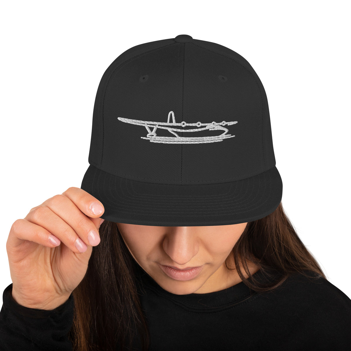 Black snapback cap with the Hawaii Mars water bomber embroidered in white on the front